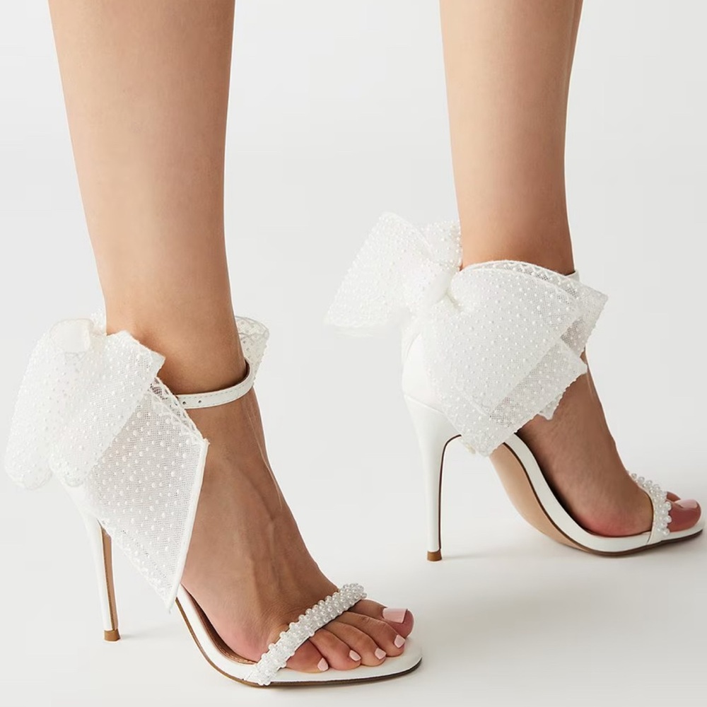 White beaded Steven Madden bow heels